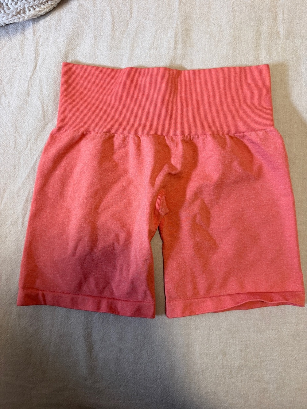 NVGTN High Waist Shorts in Coral